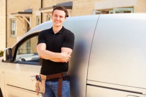 technician-standing-in-front-of-van