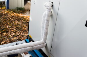 refrigerant-line-behind-ac-unit