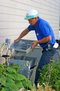 technician-working-on-outdoor-AC-unit