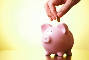 coin-being-dropped-into-a-piggy-bank