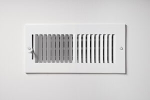 A-heating-and-cooling-vent-on-the-wall-of-a-home