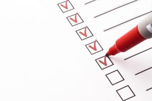 red-pen-checking-items-off-a-list