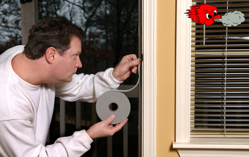 Homeowner applying weather stripping to stop air leaks around a doorway